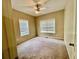 Bedroom with two windows, neutral walls and carpet, and a ceiling fan at 25 Derby Dr, Hiram, GA 30141