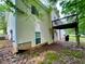 Two story home with vinyl siding, a small deck, walkout basement, and mature trees at 25 Derby Dr, Hiram, GA 30141