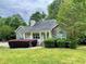 Charming single story home featuring a stone facade, covered front porch, and landscaped yard at 25 Derby Dr, Hiram, GA 30141