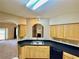 The kitchen has wooden cabinetry, and stainless appliances at 25 Derby Dr, Hiram, GA 30141
