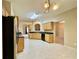 Kitchen features tile floors, light cabinets, stainless steel sink, black dishwasher, and modern lighting at 25 Derby Dr, Hiram, GA 30141