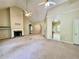 Living room features a fireplace, vaulted ceilings, and an open layout with tile flooring in background at 25 Derby Dr, Hiram, GA 30141