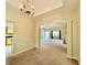 Spacious living room featuring carpet floors, and open archway to the kitchen area at 25 Derby Dr, Hiram, GA 30141