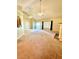 Bright, spacious living room with vaulted ceilings, ceiling fans, and a view of the front entry at 25 Derby Dr, Hiram, GA 30141