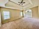 This bedroom is spacious and features a ceiling fan and large arched window at 25 Derby Dr, Hiram, GA 30141