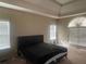 Main bedroom featuring multiple windows and tray ceilings at 25 Derby Dr, Hiram, GA 30141