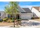 Charming two-story home featuring a two-car garage and beautifully landscaped front yard at 408 Windy Ridge Way, Canton, GA 30114
