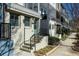 Charming townhouse showcasing a quaint entrance and inviting front steps at 711 Needletail Way, Atlanta, GA 30312