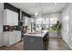 Well-equipped kitchen boasts a large island, modern appliances, and ample natural light at 711 Needletail Way, Atlanta, GA 30312