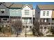 Beautiful townhomes feature colorful facades and inviting front porches at 711 Needletail Way, Atlanta, GA 30312