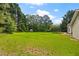 Extensive backyard with lush lawn, trampoline, and storage shed at 1230 Brook Meadow Ct, Lawrenceville, GA 30045