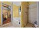Well lit bathroom featuring a tub, standup shower, toilet, and decorative fixtures at 1230 Brook Meadow Ct, Lawrenceville, GA 30045