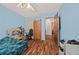Comfortable bedroom featuring wood-look flooring and easy access to other rooms at 1230 Brook Meadow Ct, Lawrenceville, GA 30045