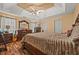 Bright bedroom featuring a large bed, dresser, bedside tables, and hardwood floors at 1230 Brook Meadow Ct, Lawrenceville, GA 30045