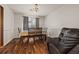 Cozy dining area with hardwood floors, table set, and gray curtains at 1230 Brook Meadow Ct, Lawrenceville, GA 30045