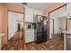 Open kitchen with black fridge and easy access to dining and living areas at 1230 Brook Meadow Ct, Lawrenceville, GA 30045