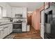 Traditional kitchen with stainless steel appliances and white cabinets at 1230 Brook Meadow Ct, Lawrenceville, GA 30045