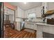 Functional kitchen with vintage cabinetry and stainless steel appliances at 1230 Brook Meadow Ct, Lawrenceville, GA 30045