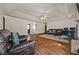 Open-concept living room with ceiling fan, fireplace, and wood flooring at 1230 Brook Meadow Ct, Lawrenceville, GA 30045