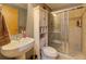 Cozy bathroom featuring tiled shower, toilet, and storage at 1133 Church St # 6, Covington, GA 30014