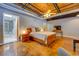 Bright and airy bedroom with a large bed, modern furnishings, and an en-suite bathroom with overhead natural wood at 1133 Church St # 6, Covington, GA 30014