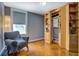 Cozy bedroom featuring a murphy bed, custom built in shelving, and a spacious window at 1133 Church St # 6, Covington, GA 30014