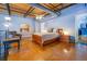 Spacious bedroom with a warm ambiance, featuring polished floors, a cozy chair, and a walk-in closet at 1133 Church St # 6, Covington, GA 30014