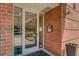 Close up of building entrance with glass door and brick wall at 1133 Church St # 6, Covington, GA 30014