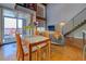 Bright dining area with glass table, balcony, and exposed brick at 1133 Church St # 6, Covington, GA 30014