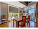Elegant dining area with sliding door to balcony and bright windows at 1133 Church St # 6, Covington, GA 30014