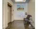 Bright hallway by elevator features mailboxes, seating, and modern decor at 1133 Church St # 6, Covington, GA 30014