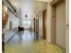 Hallway with exposed ductwork and concrete floors, leading to a well lit living area at 1133 Church St # 6, Covington, GA 30014