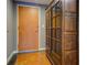 Interior view of a front door, storage armoire, and stained concrete floors at 1133 Church St # 6, Covington, GA 30014