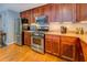 Gourmet kitchen with stainless steel appliances and custom cabinetry at 1133 Church St # 6, Covington, GA 30014
