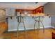 Kitchen with granite countertops and seating area, showcasing modern design and warm ambiance at 1133 Church St # 6, Covington, GA 30014