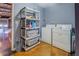 Well-organized laundry room with modern appliances, ample storage, and sleek shelving for household essentials at 1133 Church St # 6, Covington, GA 30014