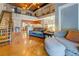 Spacious living room with open floor plan, exposed ceiling, and stainless steel kitchen appliances at 1133 Church St # 6, Covington, GA 30014