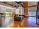 Open living area boasts high ceilings, exposed brick, and a balcony view at 1133 Church St # 6, Covington, GA 30014