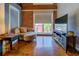 Comfortable living room features exposed brick wall, large window, and ample seating at 1133 Church St # 6, Covington, GA 30014