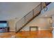 Open-concept living area featuring a modern staircase and stained concrete floors at 1133 Church St # 6, Covington, GA 30014