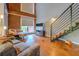 Spacious living room featuring exposed brick and modern staircase at 1133 Church St # 6, Covington, GA 30014