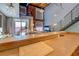 Open-concept living space with industrial-style stairs and exposed brick accents at 1133 Church St # 6, Covington, GA 30014