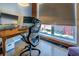 Well-lit office space showcasing a comfortable chair, exposed brick, and bright window at 1133 Church St # 6, Covington, GA 30014