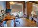 Modern office space featuring a large window, exposed brick wall, and contemporary desk setup at 1133 Church St # 6, Covington, GA 30014
