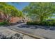 Daytime view of paved parking lot surrounding brick building and well-manicured green trees at 1133 Church St # 6, Covington, GA 30014