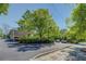 Daytime view of paved parking lot surrounded by well-manicured green trees and hedges at 1133 Church St # 6, Covington, GA 30014