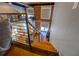 View from the loft area featuring the staircase, exposed brick, and living space at 1133 Church St # 6, Covington, GA 30014
