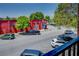 Street view showing colorful building with storefronts, and cars parked along the street at 1133 Church St # 6, Covington, GA 30014