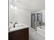 Modern bathroom featuring double vanity, white countertops, tile floors, and a glass-enclosed shower at 125 Auburn Gate Ln, Auburn, GA 30011