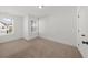 Bedroom with a neutral carpet and windows at 125 Auburn Gate Ln, Auburn, GA 30011